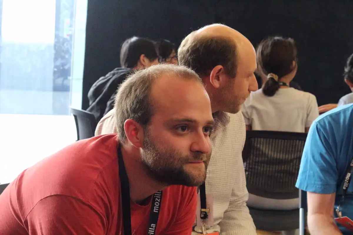 Michael listening at a conference